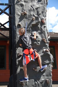 Anna Reinink climbs on the rock wall at Schweitzer Village. Photo by Ben Olson.