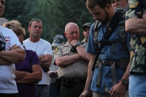 Kootenai County Sheriff Ben Wolfinger listening as a speaker addresses the crowd. Photo by Ben Olson.