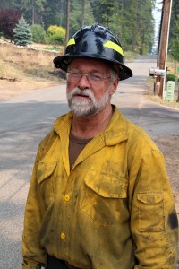 Timber faller Larry Dolezal takes a break off the line with his crew from Twisp, Wash. Photo by Ben Olson.