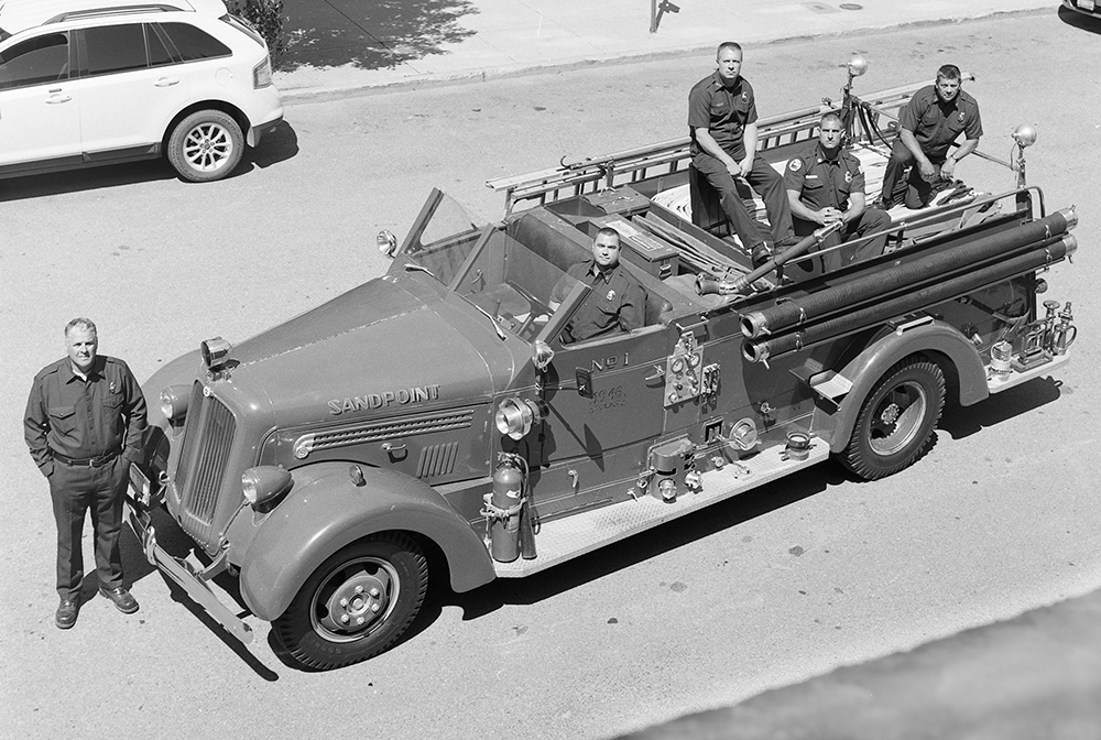 Photo taken June 17, 2015 parked in the same location as the original, with the very same engine. From left to right: Ron Stocking, Chief; Jake Hilton, Capt.; Troy Badeaux, Eng.; Jeff Littlefield, Eng.; Mick Adams, Lt Photograph by Ben Olson.
