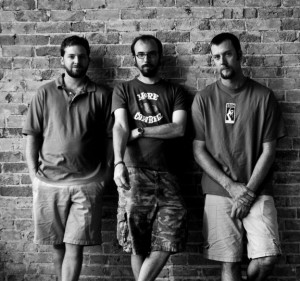 Tennis is Craig Baldwin (left), Brian Hibbard (center) and Jeremy Kleinsmith (right). Photo by Ben Olson.