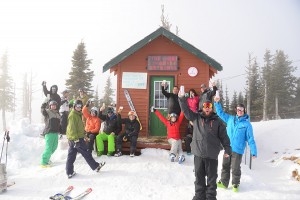 A crowd of locals hoists their beers outside the Wang Shack at the top of the Quad at Schweitzer. Photo by Ben Olson.