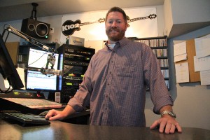Station owner Dylan Benefield in the K102 studio. Photo by Ben Olson.