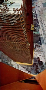 The World Trade Center towers under construction. Tim Henney had to sit on the photographer’s feet while he hung out the window and snapped this shot. Photo by Bill Shropp.
