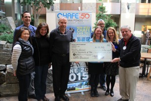CHAFE 150 hands over a check for $50,000 to Lake Pend Oreille School District at the Sandpoint Rotary Club meeting Wednesday. Pictured from left to right: Sean Woodward, Jane Huang, Paula Hall, Brad Williams, Joy Jensen, Mel Dick, Elana Westphal and Pierce Smith. Photo by Ben Olson.