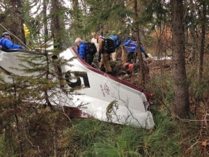A search crew investigates the wreckage at the crash site. Photo courtesy of Bonner County Sheriff's Office.
