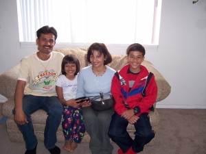 Pingala Dhital with her husband Kamal, daughter Trishna and son Satya, just one day after arriving in Spokane from a refugee camp in Nepal, where she had lived for 17 years awaiting resettlement. Pingala was carrying a pressure cooker because she was unsure that she would be able to cook her lentils without one. Photo by World Relief.