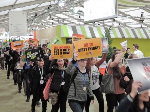 Young adults brought their passion and climate change demands throughout COP21. Photo by Gary Payton.