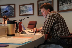 Councilman Bill Aitkin prepares before the council meeting. Photo by Ben Olson.