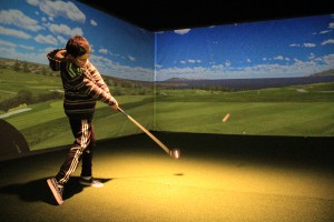 Davis McDonald, 12, tees off at Sandpoint Country Club. Photo. by Ben Olson.