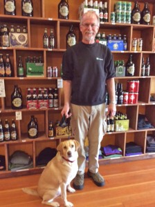 Owner Jon Hagadone "pawses" from his work to pose with Drake.