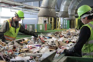Employees at the Waste Management SMaRT Recycling Center sort recyclable materials in this photo taken last spring. Photo by Ben Olson.