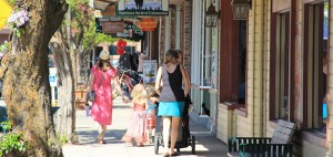 A family meanders down the First Avenue shopping district in Sandpoint. Photo by Ben Olson.