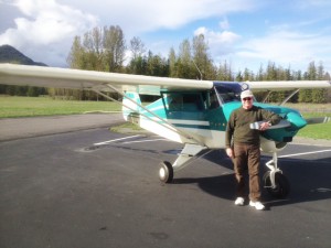 Jim Kaiser stands before his Piper Tripacer airplane. Photo by Jim Ramsey.