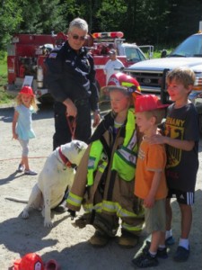 Area children get to try on the firefighting equipment and meet personnel. Photo courtesy of Sam Owen Fire District.