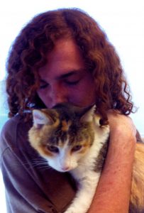 A recent photo of Adam Ferris with his special feline friend. Courtesy photo.