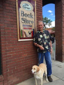 Owner Jim Orbaugh stands with Drake outside The Corner Bookstore. 
