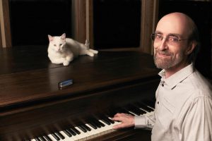 George Winston with his cat, also named Winston. Courtesy photo.