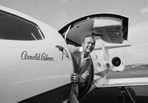 Arnold Palmer posing in his jet, circa 1960s. Photo courtesy of Creative Commons.