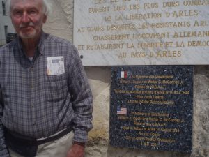 Jim Ramsey stands by the monument in Arles, France. Courtesy photo.