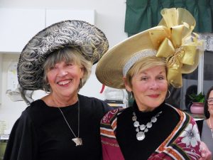 SASi volunteer Linda Melia, left and SASi board member Loris Michael, right, pose during the High Tea fundraiser last week at the Sandpoint Senior Center. Courtesy photo.