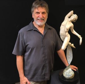 Steve Gevurtz poses with one of his creations. Photo by Kevin Penerlick. 