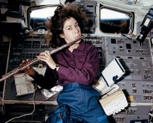 Astronaut Ellen Ochoa plays the flute in space. Photo courtesy of NASA.