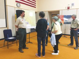 Open House attendees talk with members of Sen. Risch’s staff on Tuesday night. Photo by Lyndsie Kiebert.